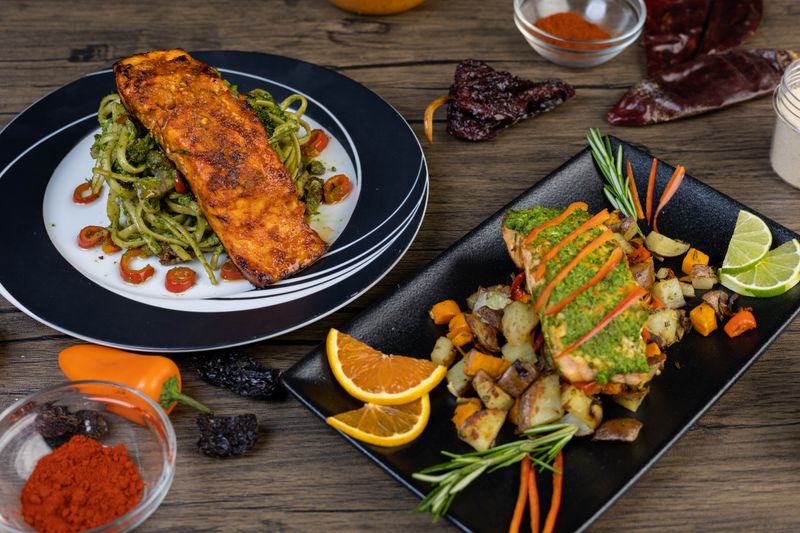 Pan-seared salmon fillet with roasted vegetables